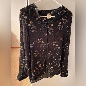Women’s patterned black blouse.